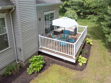 Another look at your new trex deck at the back of your new home; recent mulching for the season has been completed