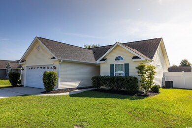 Ranch-style house featuring a garage, central AC, 