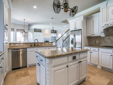 Beautiful white custom cabinetry with stainless ap