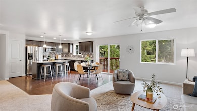 Easy flow from kitchen to dining to living room makes this whole space feel connected. And yes... brand-new carpet underfoot!