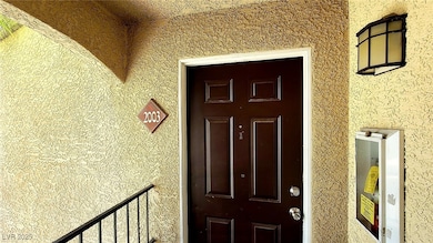 View of exterior entry featuring stucco siding
