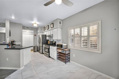 Kitchen with stainless steel appliances, a sink, a