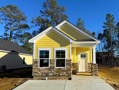 View of front facade with stone siding and central