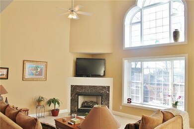 Natural light through the floor to ceiling window and custom oversized moldings give this home a special feel!