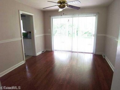 Dining Room. Glass sliding door opens to covered porch.