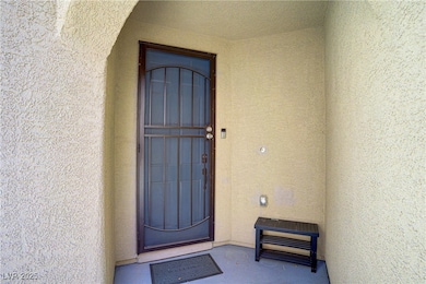 Property entrance with stucco siding