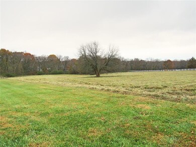 LOT BACKS TO WOODS ON SOUTH SIDE OF PROPERTY.