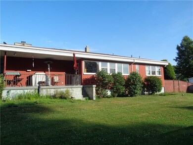 Back of home with porch for your grill.