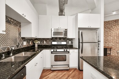 The bright & open concept kitchen has plenty of na
