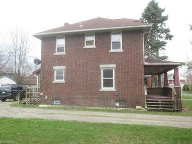 View looking west showing east side of duplex.