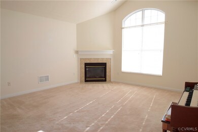 Bright great room with vaulted ceilings and gas fi