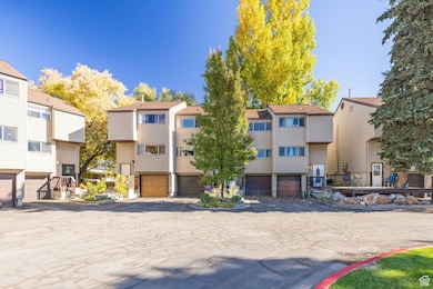 View of front of house with a residential view and a garage