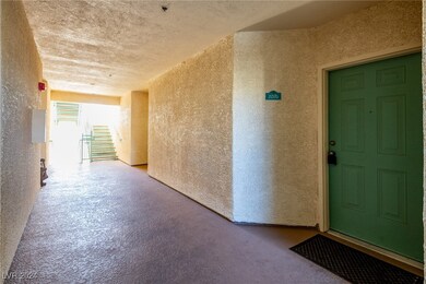 Doorway to property featuring stucco siding