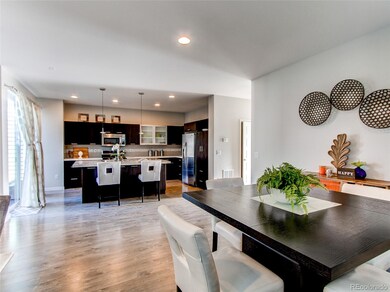 Dining room or flex room opening to kitchen.