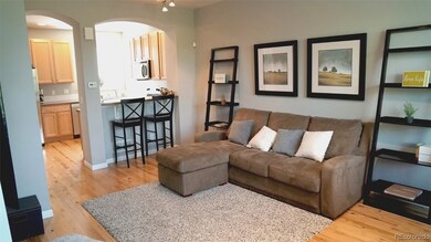 Living Room looking onto breakfast bar and into ki