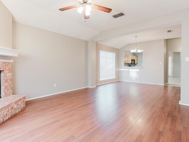 Unfurnished living room featuring visible vents, c