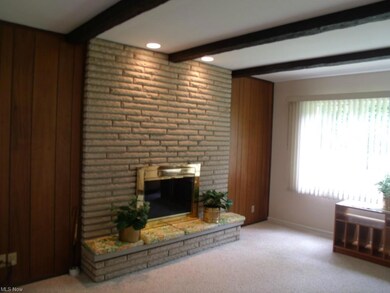 The first floor family room features a lovely wood