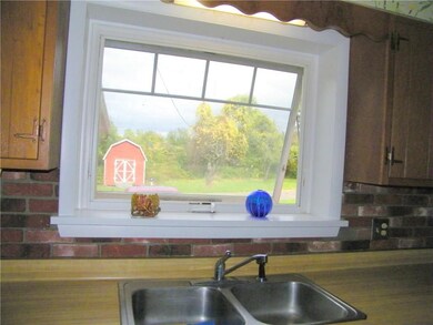 The wondow over the stainless steel sink is new an