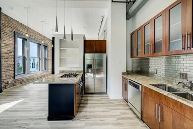 The kitchen is equipped with top-of-the-line appli