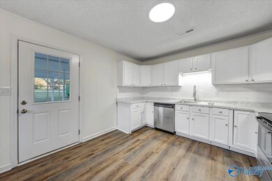 Updated Kitchen, New Stainless Appliances, Counter Tops and Tile Back Splash