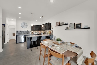 Dining room featuring recessed lighting and light wood-style flooring
