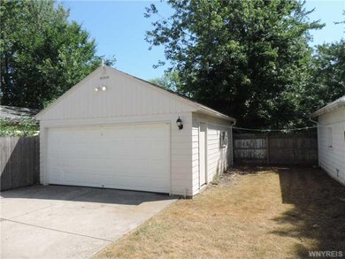 Exterior Back. The back yard & garage area.