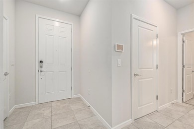 Left to right: Front door. Garage access and door to tucked away 4th bedroom