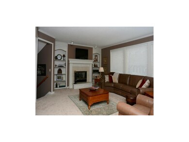 Great Room with a fireplace and open floor plan.