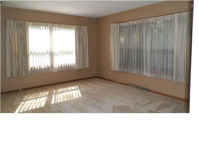 Spacious living room with large picture windows on