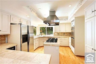 Gourmet Kitchen with a 6 Burner stove top and doub