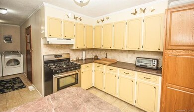 Tile backsplash and more storage in the kitchen