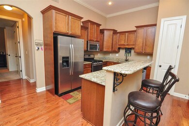 The kitchen is completed by a large island with ba