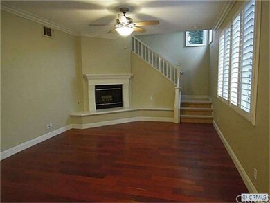 The big family room with fireplace as seen from th