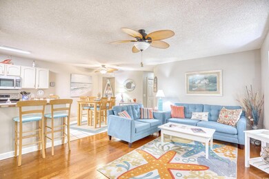 Living room featuring a textured ceiling, ceiling 