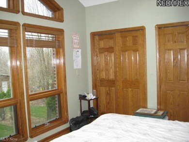 Master bedroom overlooks backyard