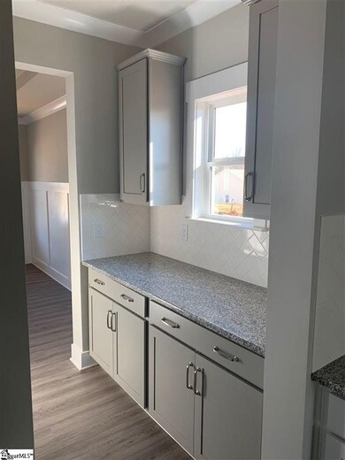 Naturally lit with upper and lower cabinetry