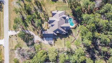 Privacy! Gated at rear Driveway! Wrought iron fencing around part of backyard!