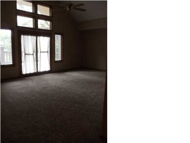 living room view to wood deck