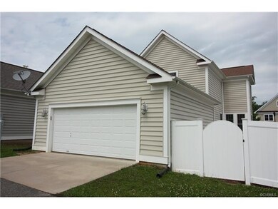 Two car garage and maintenance-free fencing