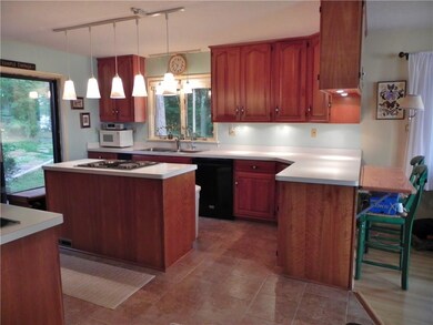 lovely cherry kitchen with ceramic tile floor and 