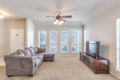 Floor to ceiling windows in the family room let in