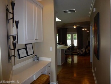 Entry. Gracious Hallway Entry with Built In Desk and Cabinets.  Could be a great Wine Bar!