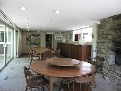 Massive dining room and sitting area with stone fl