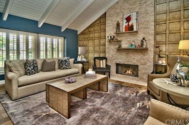 Formal Living Room with Fireplace & High Beamed Ce