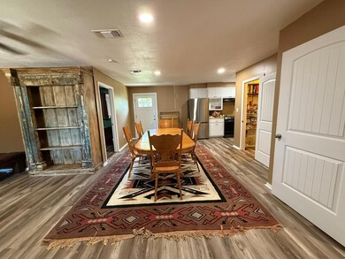 Dining space featuring wood finished floors, rece