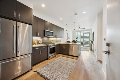 Kitchen featuring appliances with stainless steel