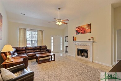 Large living room with high ceilings, fireplace, a