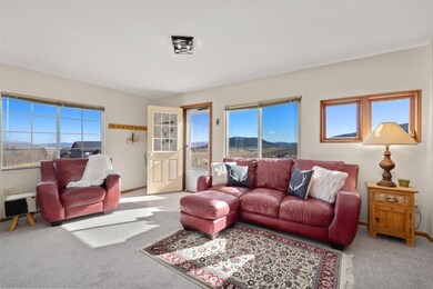 Sunny living room with tons of windows to take in
