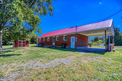 DRIVE-THROUGH CARPORT WITH DOUBLE ROAD ACCESS