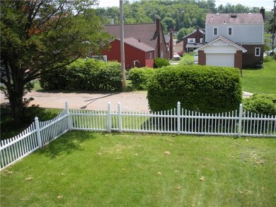 Large, level yard is completely fenced in. Great v